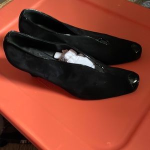 Suede and patent leather heels.